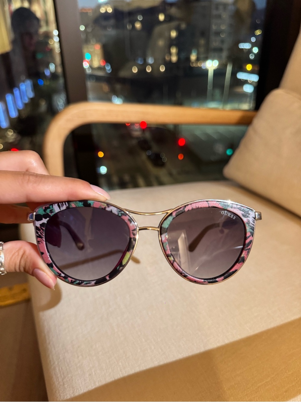 GUESS Pink Floral Cat-Eye Sunglasses with a silver bridge